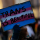 A demonstrators holds up a sign during a march to mark International Transgender Day of Visibility in Lisbon, Thursday, March 31, 2022.